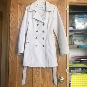 Woman’s cream trench coat